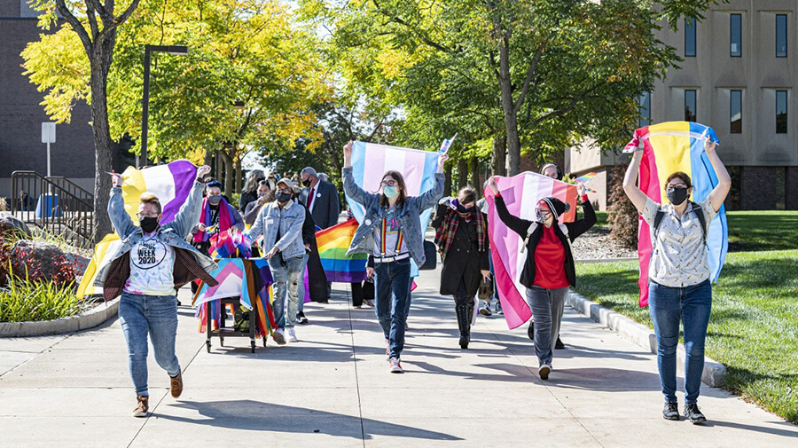 Students marching with pride flags